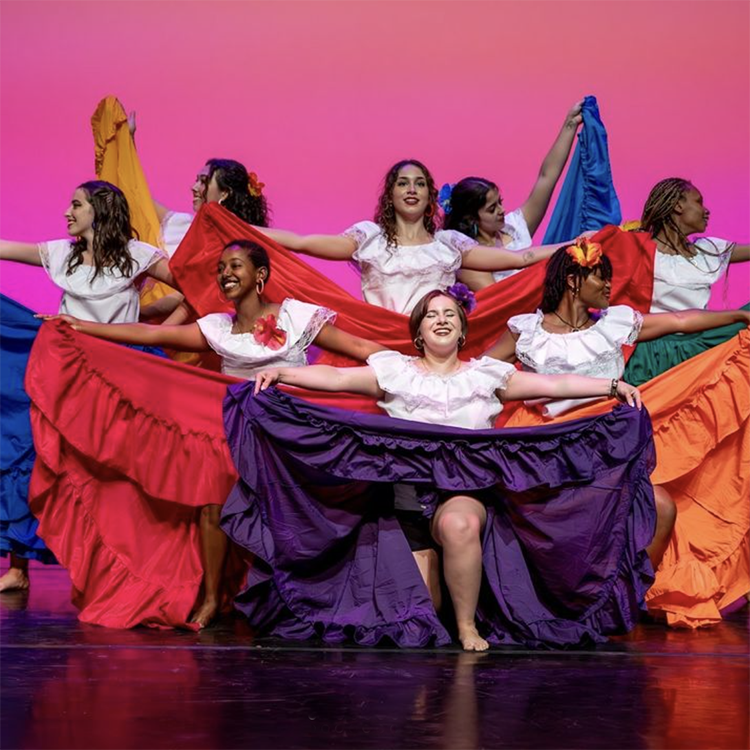 students pose after dancing as part of the Carnaval